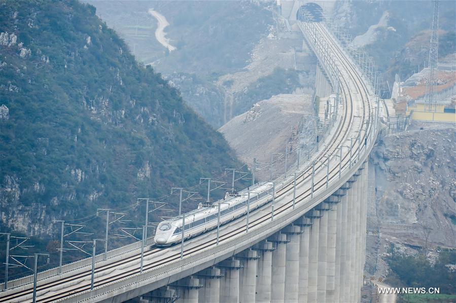 A test train in seen on the Guizhou West section of the Shanghai-Kunming high-speed railway, Dec. 17, 2016. China on Wednesday put into operation one of the world