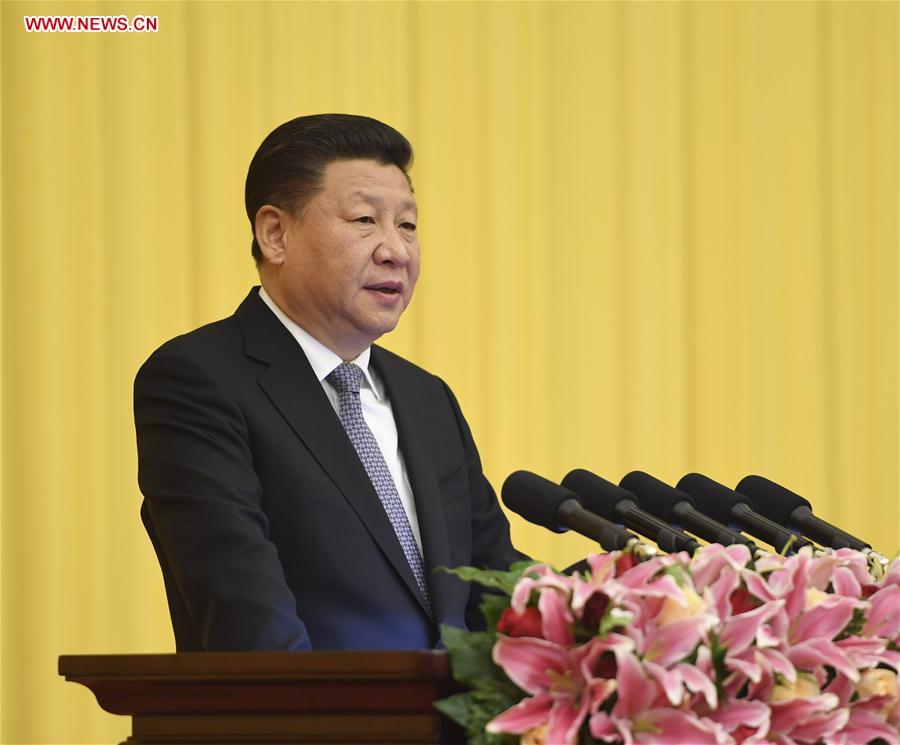 Chinese President Xi Jinping addresses a New Year gathering of the Chinese People