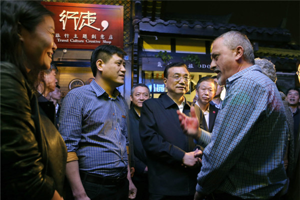 Premier Li Keqiang visits Kuanzhai Ancient Street in Chengdu, Sichuan province, on April 25, 2016. 