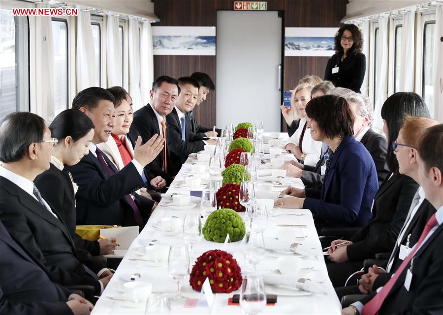 Chinese President Xi Jinping and his wife Peng Liyuan enjoy tea and conversation with Swiss President Doris Leuthard and her husband Roland Hausin in a special train on their way to Bern, capital of Switzerland, Jan. 15, 2017. After the welcome ceremony at the Zurich airport, Xi traveled to the Swiss capital of Bern by a special train of the Swiss government. (Xinhua/Lan Hongguang)