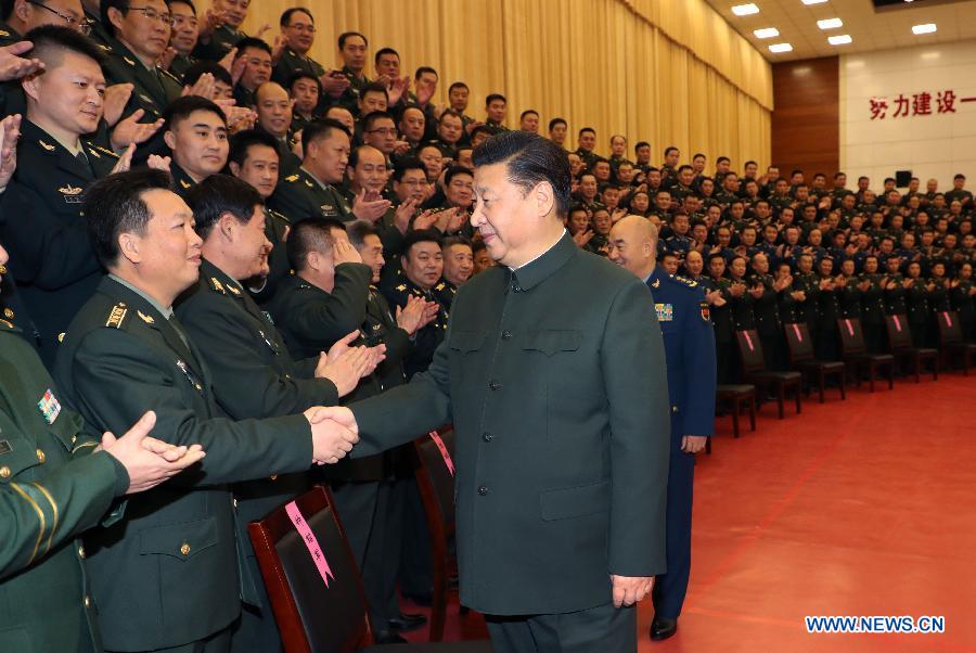 Chinese President Xi Jinping (R, front), also general secretary of the Communist Party of China (CPC) Central Committee and chairman of the Central Military Commission, shakes hands with senior military officers stationed in Zhangjiakou City, north China