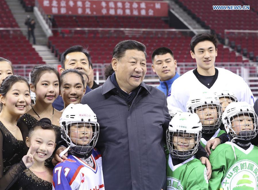 Chinese President Xi Jinping poses for a group photo with ice hockey and skating fans at Wukesong sports center in Beijing, capital of China, Feb. 24, 2017. Xi, also general secretary of the Communist Party of China Central Committee and chairman of the Central Military Commission, made an inspection tour in Beijing Thursday and Friday. (Xinhua/Ding Lin)