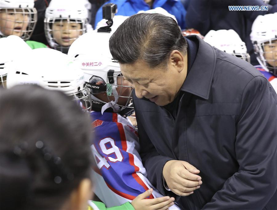 Chinese President Xi Jinping and ice hockey fans greet each other at Wukesong sports center in Beijing, capital of China, Feb. 24, 2017. Xi, also general secretary of the Communist Party of China Central Committee and chairman of the Central Military Commission, made an inspection tour in Beijing Thursday and Friday. (Xinhua/Ding Lin)