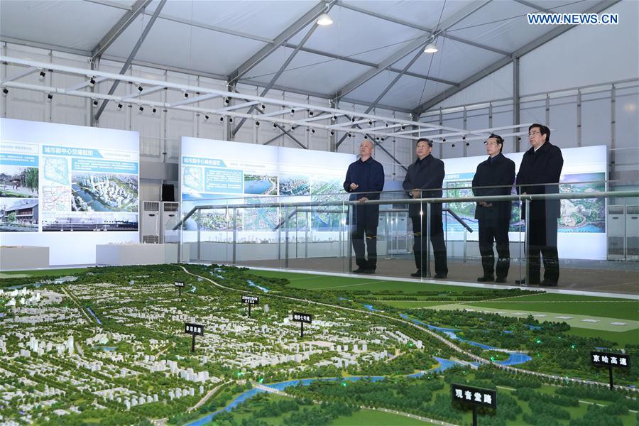 Chinese President Xi Jinping (2nd L) inspects the construction site of the capital