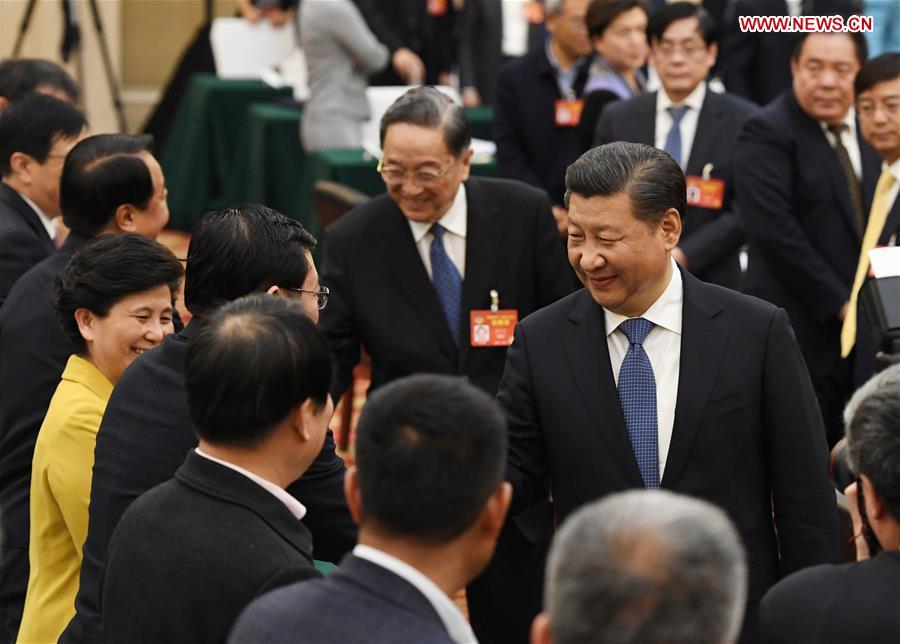 Chinese President Xi Jinping joins a panel discussion with political advisors from the China Association for Promoting Democracy, the Chinese Peasants and Workers Democratic Party and the Jiu San Society at the fifth session of the 12th National Committee of the Chinese People