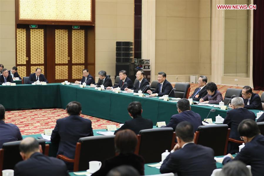 Chinese President Xi Jinping joins a panel discussion with political advisors from the China Association for Promoting Democracy, the Chinese Peasants and Workers Democratic Party and the Jiu San Society at the fifth session of the 12th National Committee of the Chinese People