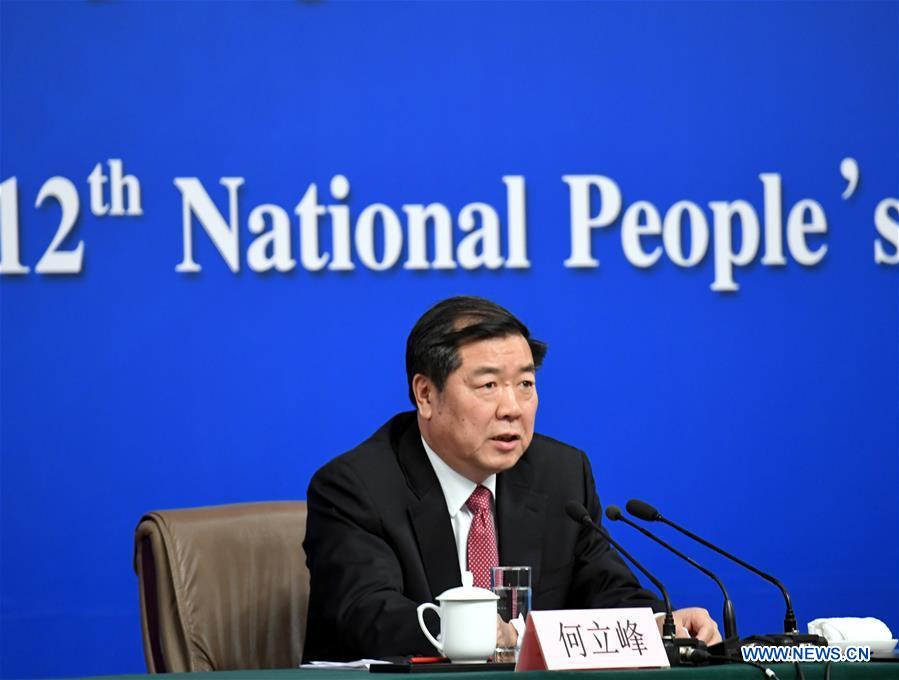 Director of the National Development and Reform Commission (NDRC) He Lifeng answers questions during a press conference on China