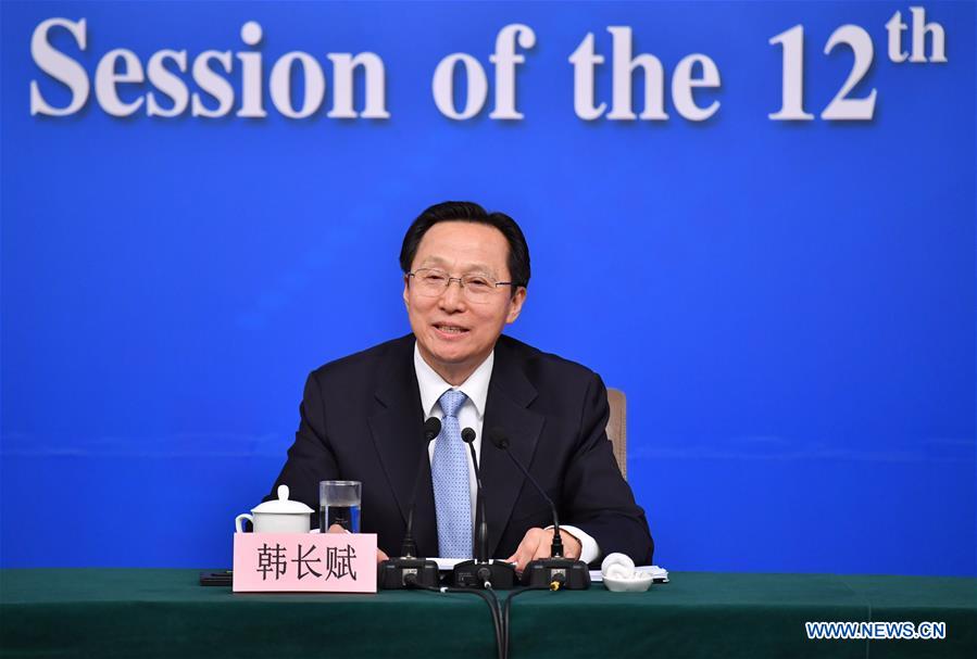 Chinese Minister of Agriculture Han Changfu takes questions on promoting agricultural structure reform on supply-side at a press conference for the fifth session of the 12th National People