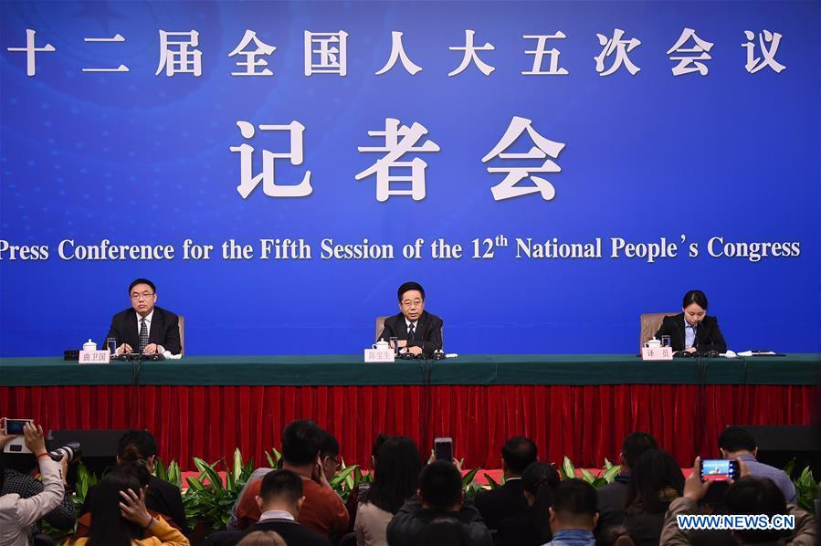 Chinese Minister of Education Chen Baosheng answers questions at a press conference on education reform and development for the fifth session of the 12th National People