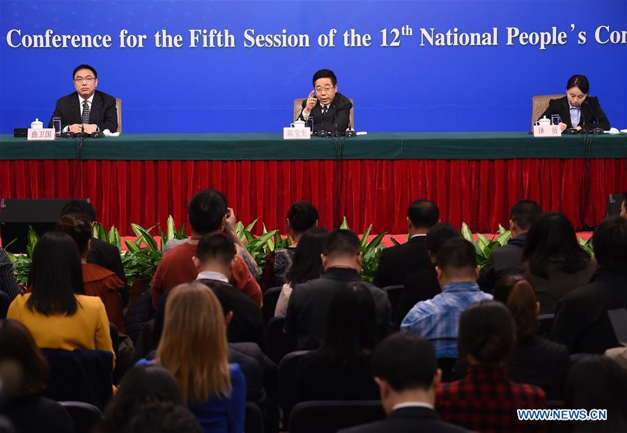 Chinese Minister of Education Chen Baosheng answers questions at a press conference on education reform and development for the fifth session of the 12th National People