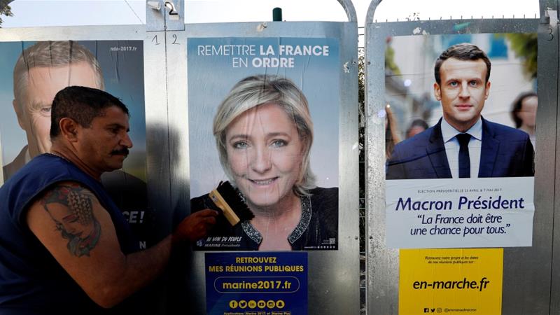 Far-right leader Le Pen (L) and centrist Macron (R) advance to French presidential runoff after major opponents concede defeat 