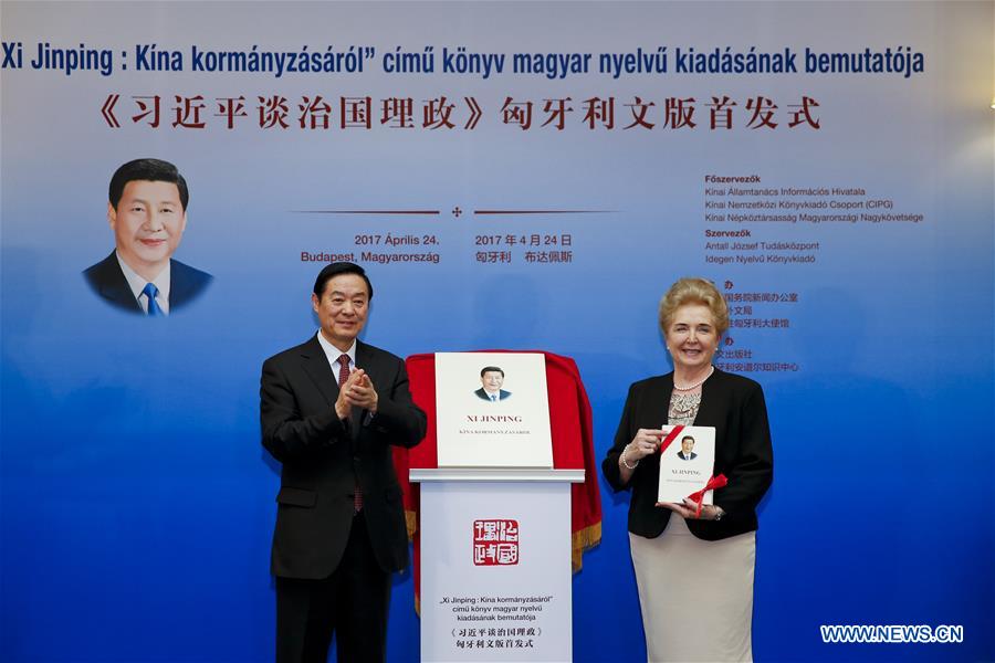 Liu Qibao (L), member of the Political Bureau of the Central Committee of the Communist Party of China (CPC) and head of the Publicity Department of the CPC Central Committee, and Matrai Marta, executive vice chairman of the Hungarian National Assembly, attend the release ceremony of the Hungarian version of Chinese President Xi Jinping