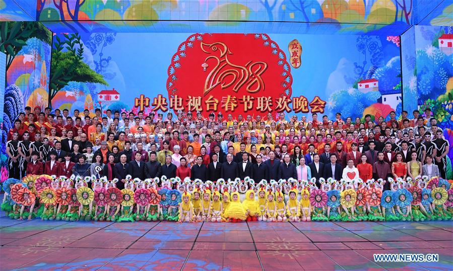 Huang Kunming, a member of the Political Bureau of the Communist Party of China (CPC) Central Committee and the head of the Publicity Department of the CPC Central Committee, poses for a group photo when inspecting the rehearsal of China Central Television