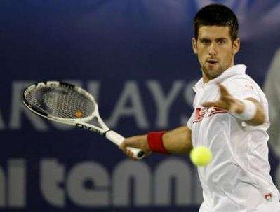 Novak Djokovic of Serbia returns a shot against Guillermo Garcia-Lopez of Spain during their match on the first day of the ATP Dubai Tennis Championships February 22, 2010. REUTERS/Karl Jeffs