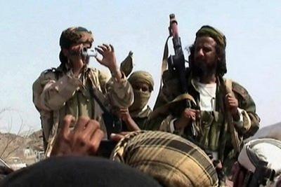 Men claiming to be Al-Qaeda members are seen addressing a crowd in Yemen's southern province of Abyan, on December 22. (AFP/File)