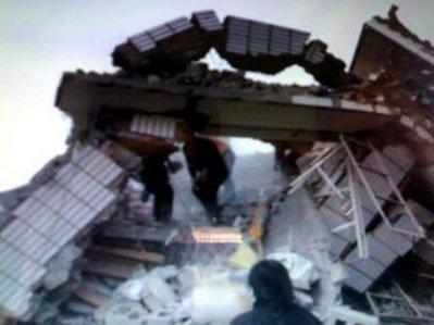 A photo taken by a mobile phone shows destroyed houses after an earthquake hit the Tibetan Autonomous Prefecture of Yushu, northwest Qinghai province in China April 14, 2010 
