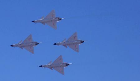 J-10 fighters of the Bayi (Aug. 1) Aerobatics Team of the Air Force of the Chinese People's Liberation Army (PLA) perform during a rehearsal for the celebration of the 60th anniversary of the founding of the Air Force in Beijing, capital of China, Nov. 3, 2009. The anniversary falls on Nov. 11.(Xinhua/Li Gang)