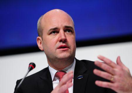 EU rotating president, Swedish Prime Minister Fredrik Reinfeldt addresses a press conference during the high-level segment of the United Nations Framework Climate Change Conference in Copenhagen, Denmark, Dec. 16, 2009.(Xinhua/Zeng Yi)