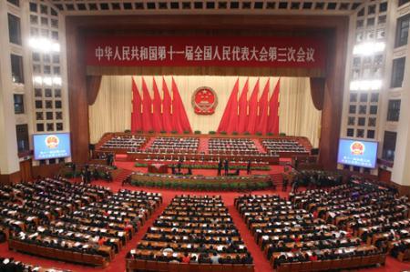 The second plenary meeting of the Third Session of the 11th National People's Congress (NPC) is held at the Great Hall of the People in Beijing, capital of China, March 8, 2010. Wang Zhaoguo, vice chairman of the NPC Standing Committee, made an explanation of a draft amendment to the Electoral Law, which provides legal guarantees for elections of deputies to people's congresses, during the meeting on Monday. (Xinhua/Liu Weibing)