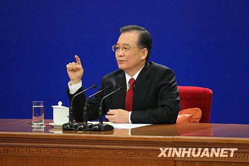 Chinese Premier Wen Jiabao smiles during a press conference after the closing meeting of the Third Session of the 11th National People's Congress (NPC) at the Great Hall of the People in Beijing, capital of China, March 14, 2010. (Xinhua/Xing Guangli)