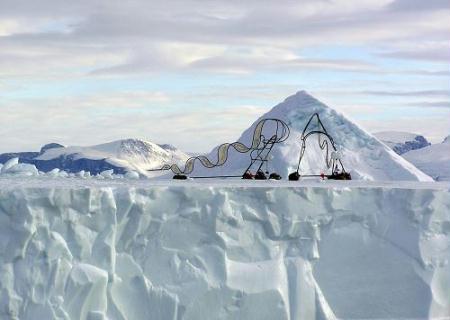 A pair of metal sculptures is seen on an iceberg near the town of Uummannaq in western Greenland March 19, 2010. Ap Verheggen, a 45-year-old artist from The Hague, said he had built the swirling metal sculptures, which represent a dog sled, to highlight the impact of a warmer climate on the Inuit people, who struggle to move around on thinning ice. (Xinhua/Reuters)