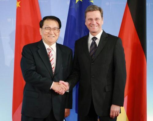 Li Changchun (L), a member of the Standing Committee of the Political Bureau of the Communist Party of China Central Committee, meets with German Vice Chancellor and Foreign Minister Guido Westerwelle in Berlin, April 13, 2010. (Xinhua/Luo Huanhuan)