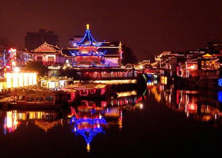 Photo taken on Feb. 11, 2010 shows the colorful night scene of the Confucian Temple in Nanjing, capital of east China's Jiangsu Province. The 2010 Jiangsu Qinhuai Lantern Fair, which is also the 24th Confucian Temple Spring Festival Lantern Fair, kicked off in Nanjing on Thursday.(Xinhua/Wang Qiming)