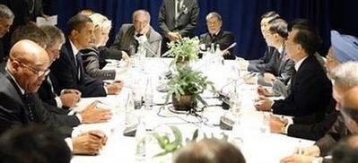 U.S. President Barack Obama (on L) sits with South Africa's President Jacob Zuma (L), Brazil's President Luiz Inacio Lula da Silva (3rd L), Chinese Premier Wen Jiabao (4th R), Indian Prime Minister Manmohan Singh (3rd R) and other world leaders during a multi-lateral meeting at the Bella Center in Copenhagen December 18, 2009. REUTERS/Larry Downing