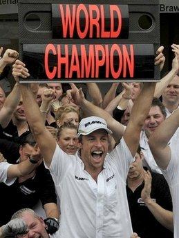 Jenson Button celebrates with Brawn GP teammates his F-1 World Champion title after the Brazil's F1 GP, on October 18, at Interlagos race track in Sao Paulo. Button believes his attempt to become the first British driver to retain the F1 drivers' world title will be one of the most difficult in the history of the sport.