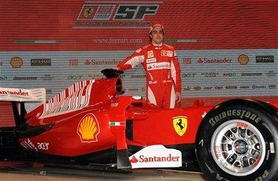 In this image released by Ferrari Press office Thursday, Jan. 28, 2010 Ferrari Spanish driver Fernando Alonso poses next to the new Formula One car unveiled in Maranello, Italy.