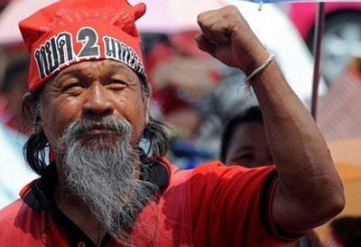 "Red Shirt" supporter of ousted premier Thaksin Shinawatra shouts slogans during an anti-government protest in Bangkok. (AFP/Pornchai Kittiwongsakul)