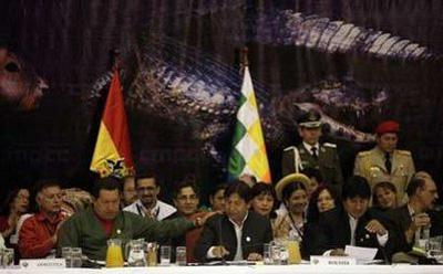 Venezuela's President Hugo Chavez (L), Bolivia's Foreign Minister David Choquehuanca (C) and President Evo Morales (R) participate in the World People's Conference on Climate Change and the Rights of Mother Earth in Tiquipaya on the outskirts of Cochabamba April 22, 2010. REUTERS/Gaston Brito