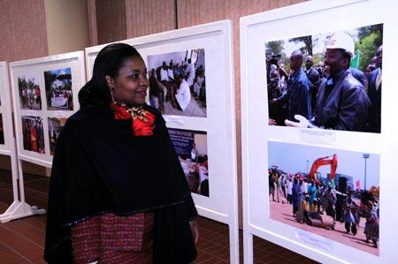 A woman visits the photo exhibition about the achievements of the follow-up actions of the Beijing Summit of the Forum on China-Africa Cooperation (FOCAC), in Tunis, capital of Tunisia, on Nov. 9, 2009. The week-long photo exhibition, held by the Chinese Embassy to Tunisia, started in Tunis on Nov. 9. (Xinhua/Liu Shun)