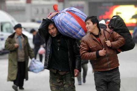 Passengers walk out from Beijing West Railway Station in Beijing, China, Jan. 20, 2010.  (Xinhua/Jin Liangkuai) 