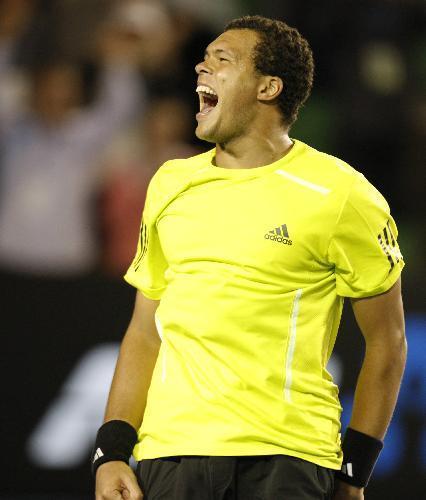 Jo-Wilfried Tsonga of France celebrates the victory after the quarter-final match of men's singles against Novak Djokovic of Serbia at 2010 Australian Open Tennis Championship at Rod Laver Arena in Melbourne, Australia, Jan. 27, 2010. Tsonga won 3-2. (Xinhua/Wang Lili)