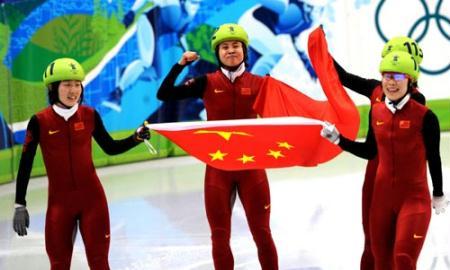 China's Sun Linlin (L), Wang Meng (2nd L), Zhou Yang (front in R) and Zhang Hui celebrate after the women's 3000m relay final of short track speed skating at the 2010 Winter Olympic Games in Vancouver, Canada, Feb. 24, 2010. China's team won the title of the event with a world-record-breaking time 4:06.610. (Xinhua/Shen Hong)