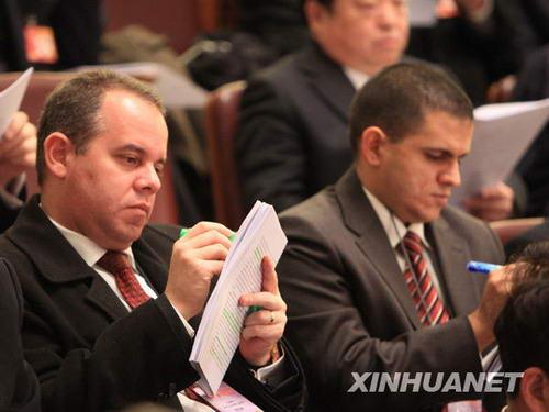 The United States Ambassador to China, Jon M. Huntsman Jr., walks towards the Great Hall of the People, where China's National People's Congress (NPC) - the country's parliament - started its annual full session in Beijing Friday morning. Some ambassadors to China have attended the opening ceremony and listened to Premier Wen Jiabao's government work report.