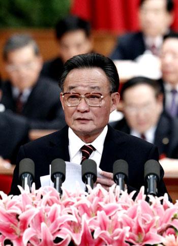 Wu Bangguo, chairman of the Standing Committee of the National People's Congress (NPC), delivers a work report of the Standing Committee of the NPC during the third plenary meeting of the Third Session of the 11th NPC at the Great Hall of the People in Beijing, capital of China, March 9, 2010. (Xinhua/Liu Jiansheng)