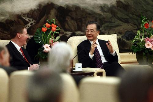 Chinese Premier Wen Jiabao (R) meets with foreign delegates attending the two-day China Development Forum 2010, in Beijing, China, March 22, 2010 (Xinhua/Liu Weibing)