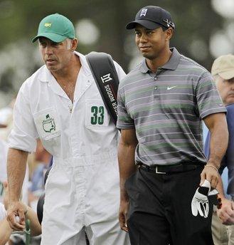 Tiger Woods makes his way to the first tee with caddie Steve Williams during the first round of the Masters golf tournament in Augusta, Ga. on Apirl 8, 2010. [Agencies]