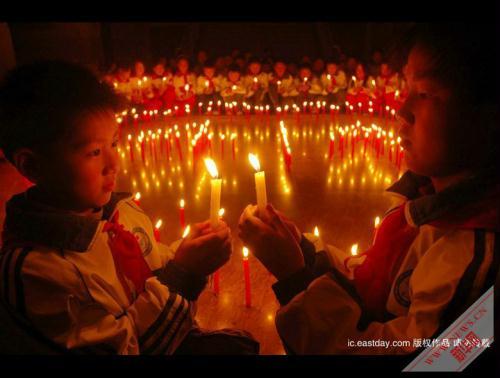 People across China light candles to mourn the Yushu earthquake dead and pray for the affected. (Xinhua Photo)