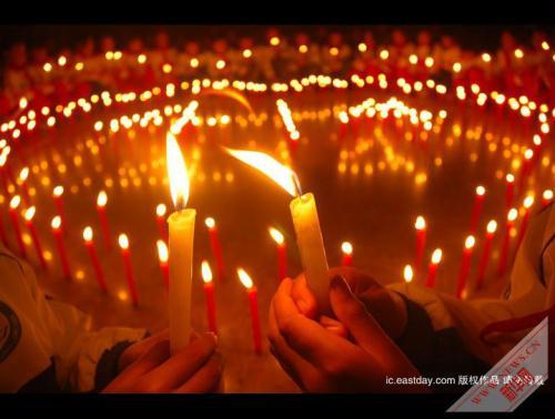 People across China light candles to mourn the Yushu earthquake dead and pray for the affected. (Xinhua Photo)