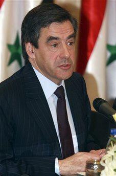 French Prime Minister Francois Fillon talks to reporters during a joint press conference with his Syrian counterpart Mohammad Naji Ottari in Damascus, Syria on Saturday, Feb. 20, 2010. (AP Photo/Bassem Tellawi)