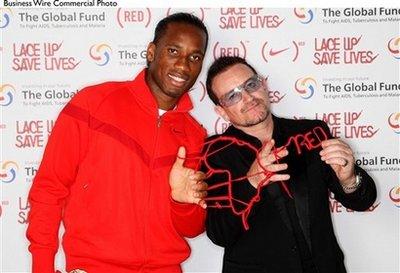 Niketown, London - 30th November 2009: Didier Drogba and Bono at the global launch of the partnership between Nike and (RED). Red Nike laces will be worn by footballers around the world in the build-up to South Africa 2010 and 100% of the profits from sales of the laces will provide money for education and medication programmes designed to fight AIDS in Africa.