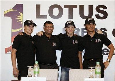 Formula One drivers Italy's Jarno Trulli, second right, Finland's Heikki Kovalainen, left, and Malaysia's Fairuz Fauzy, right, are pictured with Lotus F1 racing team principal Tony Fernandes at a press conference in Kuala Lumpur, Malaysia, Monday, Dec. 14, 2009. Trulli, Kovalainen and Fauzy will race for Lotus when the Malaysian-backed Formula One team returns to the starting grid next season.(AP Photo/Mark Baker)