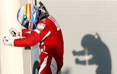 Ferrari driver Fernando Alonso of Spain celebrates after winning the Formula One Bahrain Grand Prix, at the Bahrain International Circuit in Sakhir, Bahrain, Sunday, March 14, 2010.(AP Photo/Luca Bruno) 