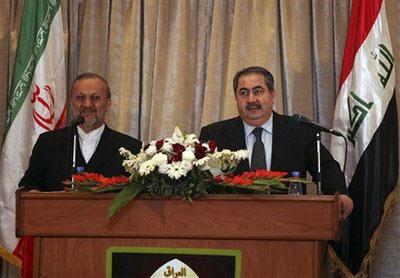 Iranian foreign minister Manouchehr Mottaki, left, and his Iraqi counterpart Hoshyar Zebari hold a joint press conference in Baghdad, Iraq, Thursday, Jan. 7, 2010. (AP Photo/Karim Kadim)