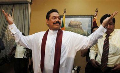 Sri Lankan President Mahinda Rajapaksa gestures as he reacts to a question raised by a journalist during a media briefing at his office in Colombo, Sri Lanka, Wednesday, Jan. 27, 2010. (AP Photo/Eranga Jayawardena)