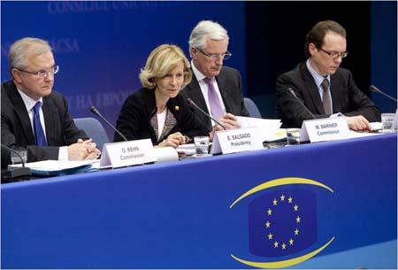 Elena Salgado, the finance minister of Spain, with, from left, Olli Rehn, Michel Barnier, and Algirdas Semeta of the European Commission at a news conference in Brussels on Tuesday.(Olivier Hoslet/European Pressphoto Agency)