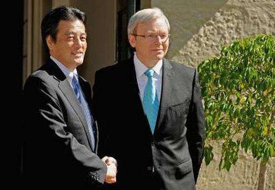 Japan's Foreign Minister Katsuya Okada (L) shakes hands with Australian Prime Minister Kevin Rudd in Sydney February 20, 2010. REUTERS/Greg Wood/Pool